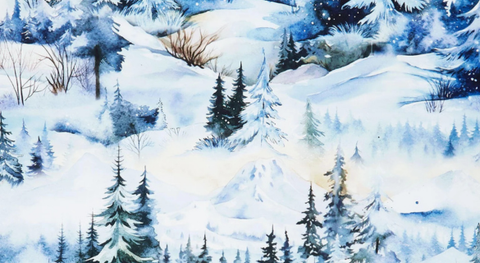 Cotton quilt fabric featuring blue and green trees on a snowy, blue background. 