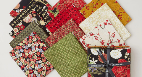 a selection of fat quarter fabric prints from the lotus garden fabric collection.