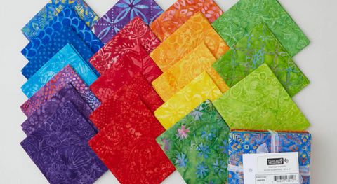 A colorful selection of fat quarter fabrics from the Tonga Batiks Happy Fabric Collection.