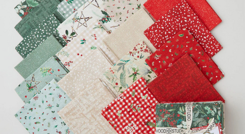 a selection of festive fat quarter fabrics from the Winter Wreaths fabric collection.